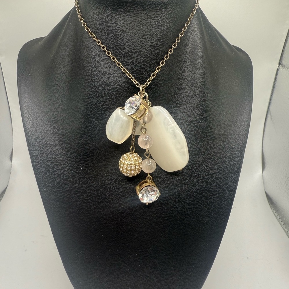 Long necklace with cluster pendant of quartz-like stones and rhinestones